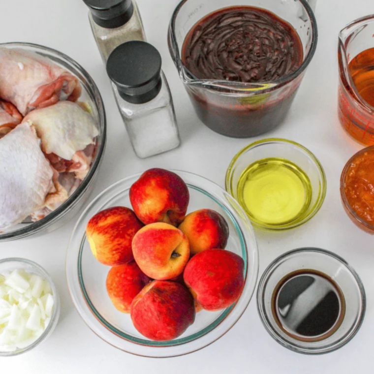 Ingredients needed for Easy Air Fryer Peach Chicken Thighs on kitchen table.