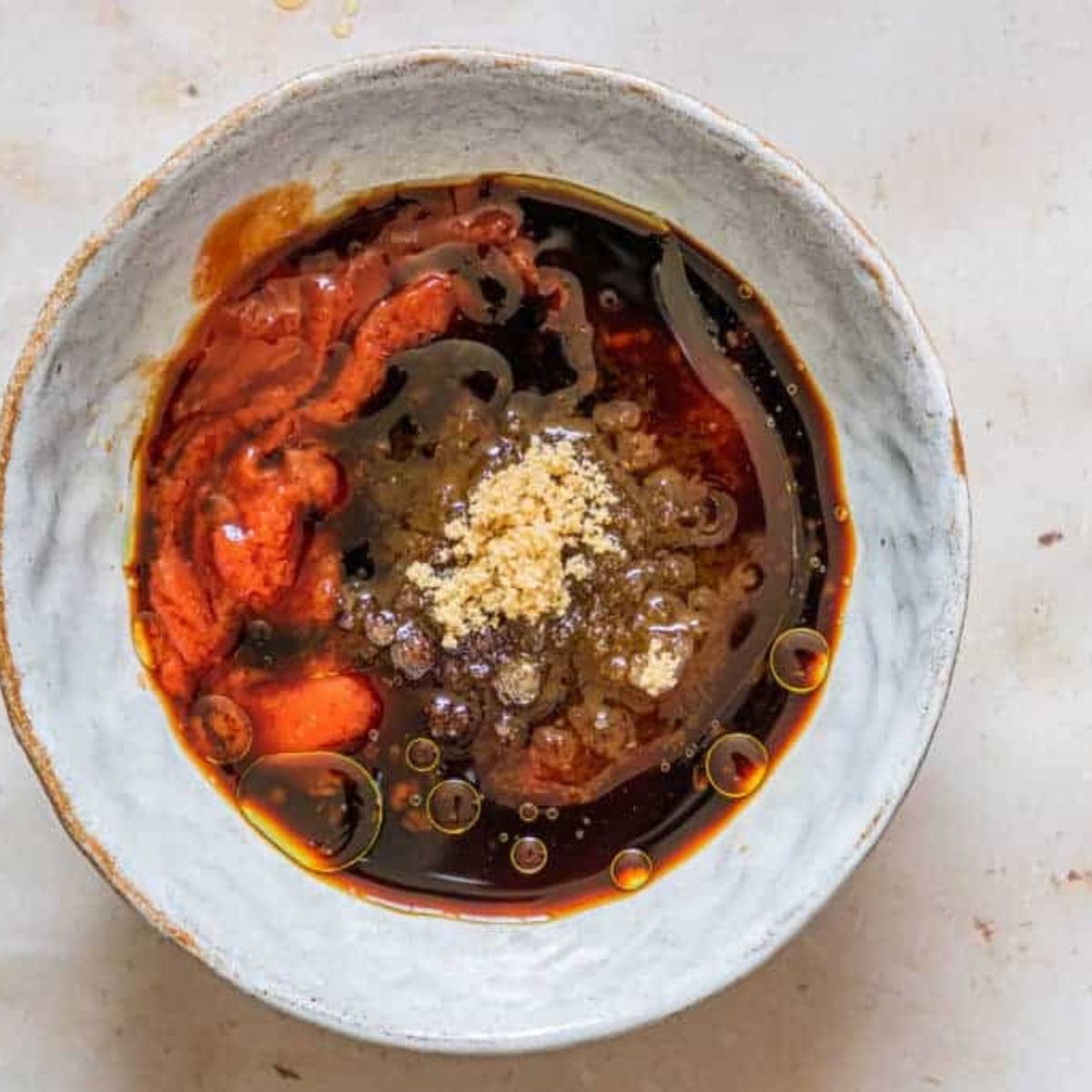 Ketchup, Worcestershire sauce, yellow mustard, lemon juice, and hot sauce measured into small bowls