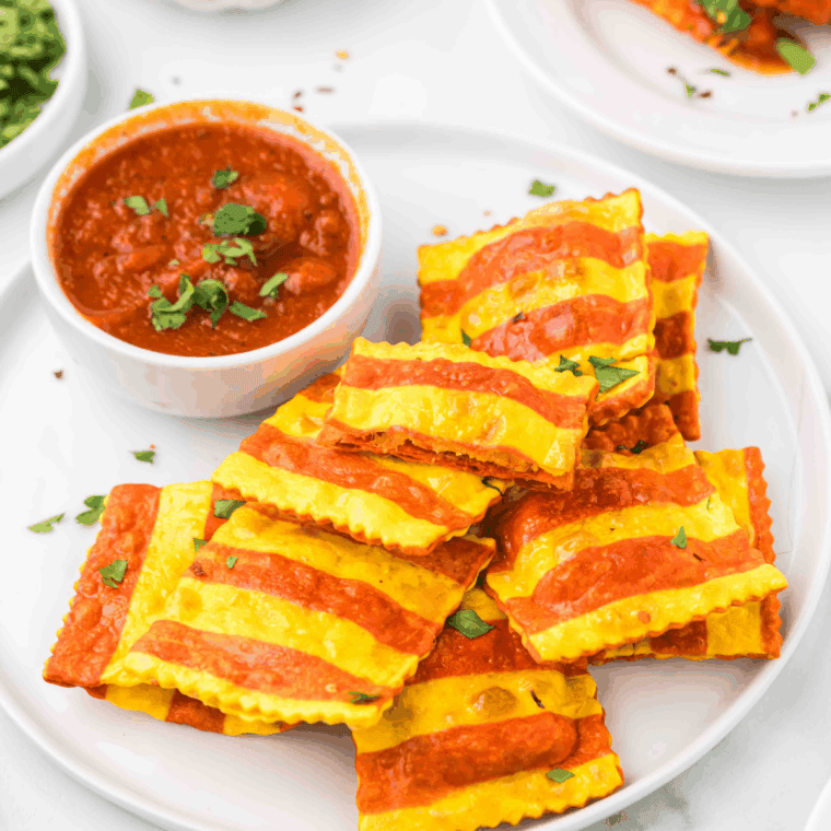 Crispy golden Air Fryer Trader Joe’s lobster ravioli served on a plate with garnishes.