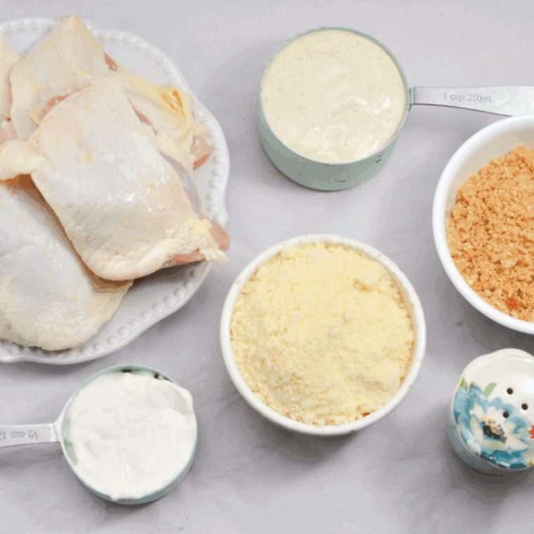 Ingredients needed for Easy Air Fryer Caesar Chicken Thighs on kitchen table.