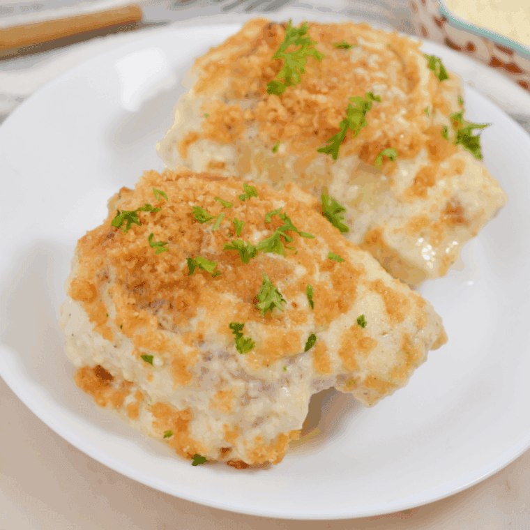 Air fryer Caesar chicken thighs cooking until golden and crispy