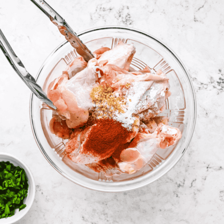 Chicken wings tossed in olive oil and evenly coated with Louisiana rub seasoning