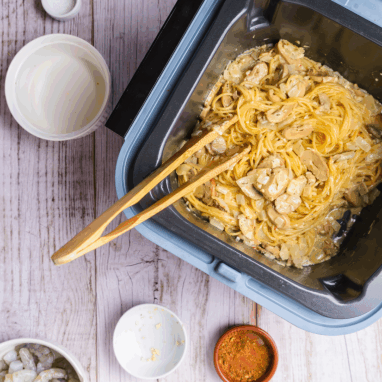 Cooking Cajun chicken linguini Alfredo in the Ninja Speedi at 375°F, stirring frequently