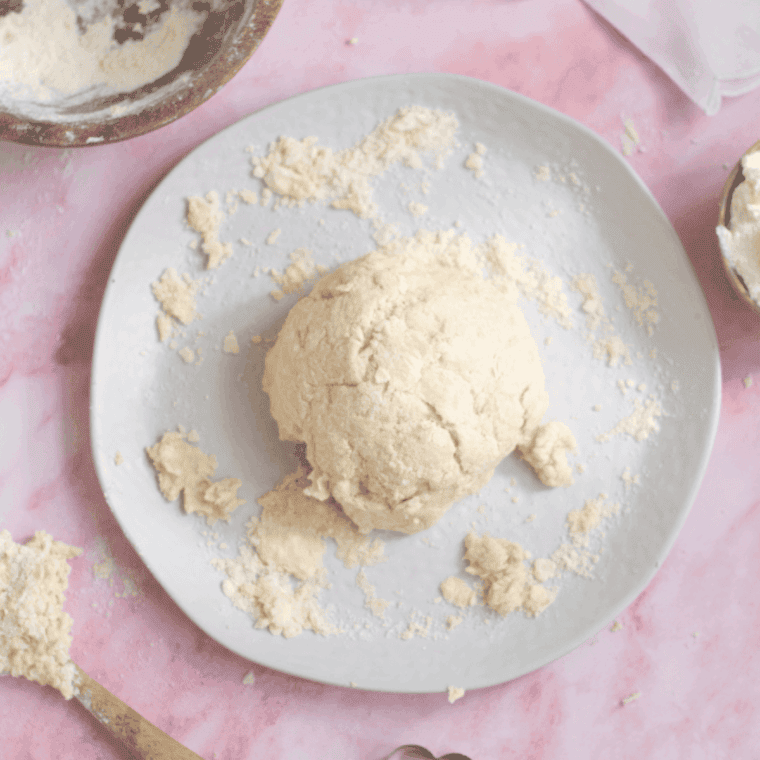 Lemonade scone dough patted into a circle and cut into wedges.