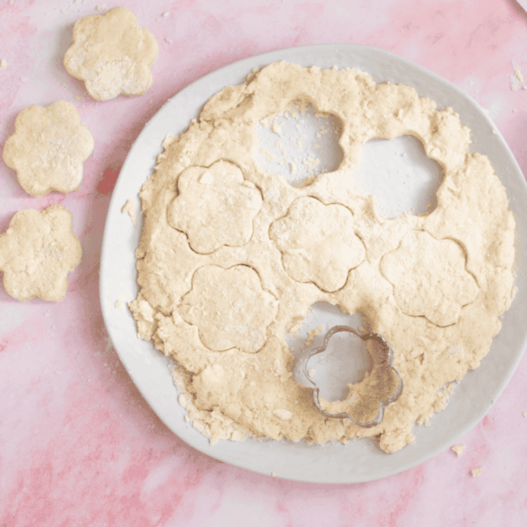 Shaped scones in a single layer in the air fryer basket.