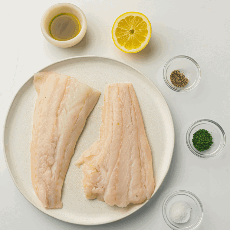 Ingredients needed for Easy Air Fryer Pesto Cod Recipe on kitchen table.