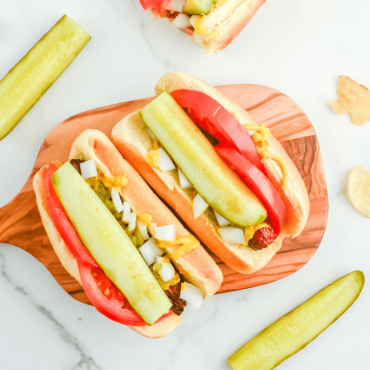 Hot dog buns toasting in an air fryer until warm, golden, and lightly crispy using quick 2-minute methods.