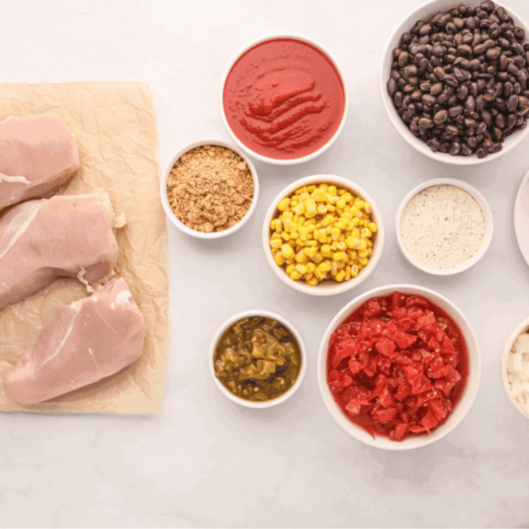 Ingredients needed for Copycat Crockpot Jason's Deli's Chicken Chili Recipe on kitchen table.