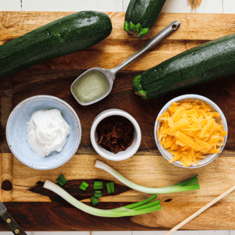 Ingredients needed for Easy Air Fryer Hasselback Zucchini on kitchen table.