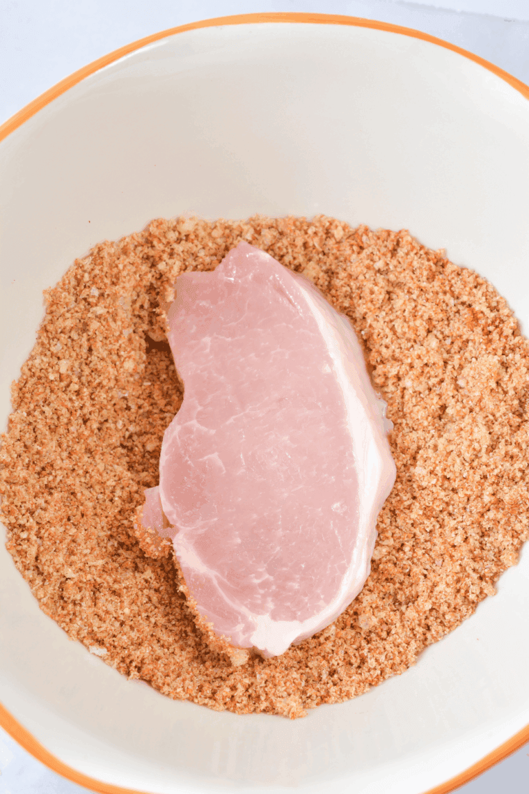 Dip Easy Bob Evan’s Pork Chops in the breadcrumbs.
