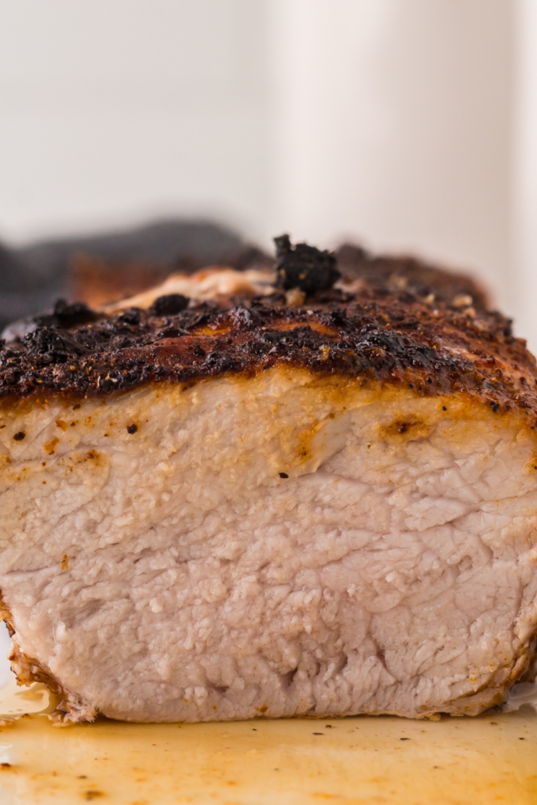 Juicy, sliced pork tenderloin cooked in a Ninja Foodi, ready to serve