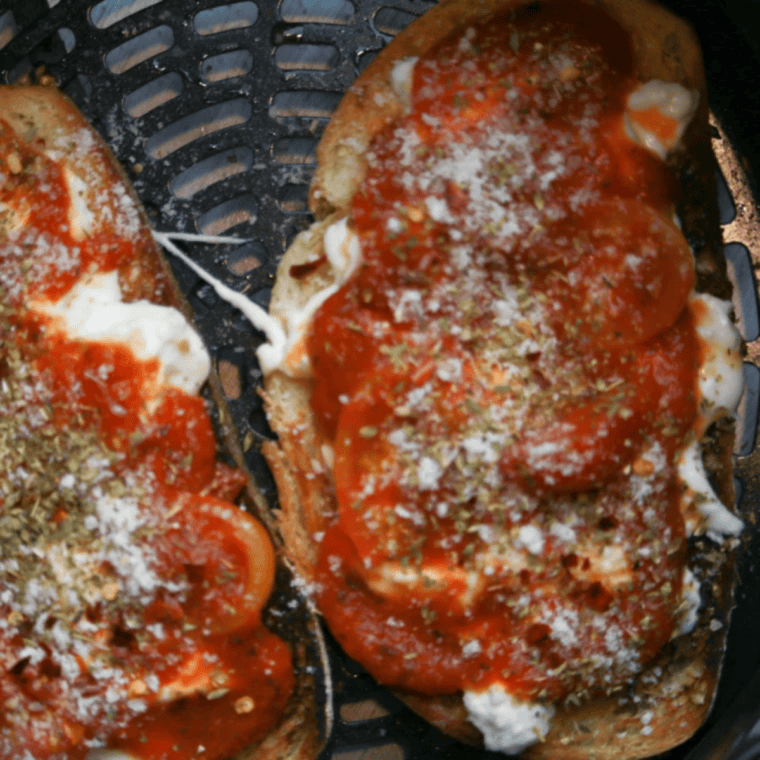 Crispy air fryer pizza topped with creamy burrata cheese and fresh toppings on golden crust