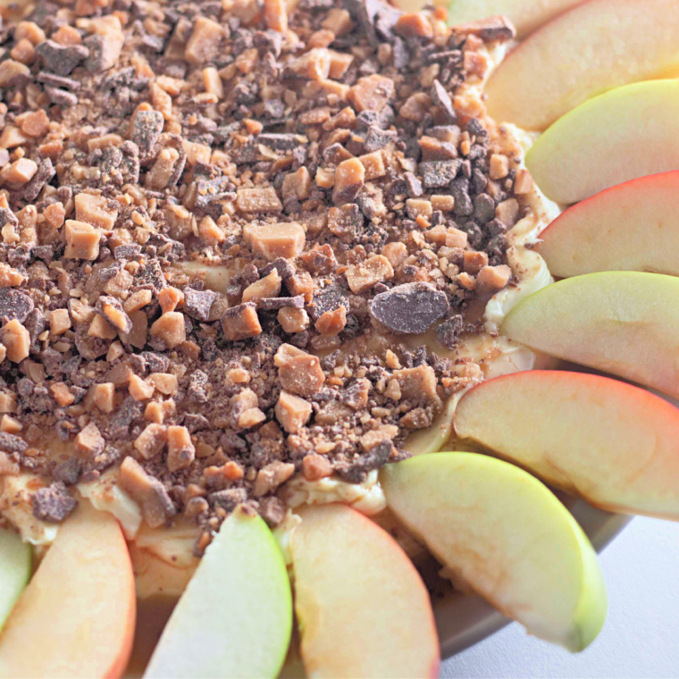 Creamy toffee apple dip served with fresh sliced apples
