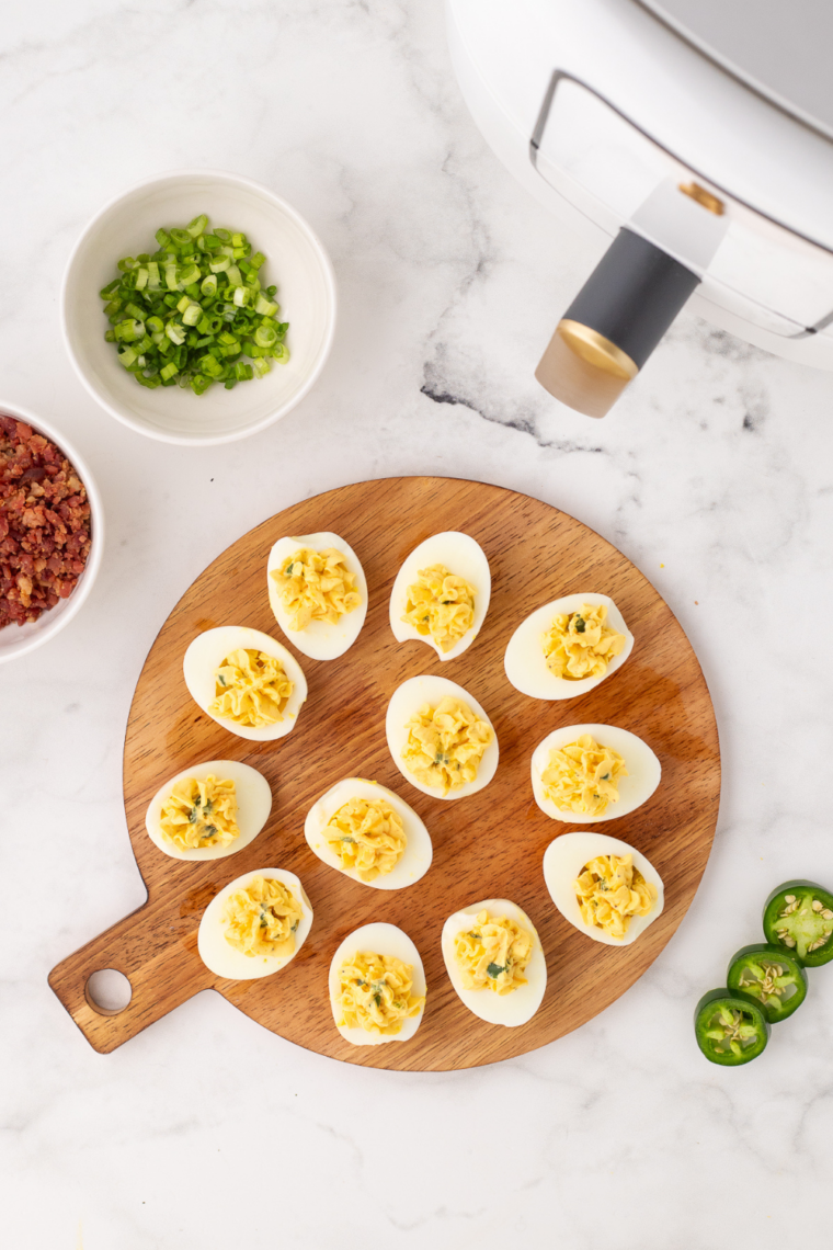 Gluten free deviled egg filling piped into egg white halves