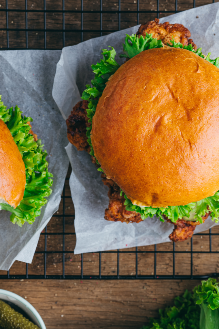 Golden crispy hand-breaded chicken fillet on a toasted bun with pickles and mayo, copycat Hardee’s chicken sandwich.