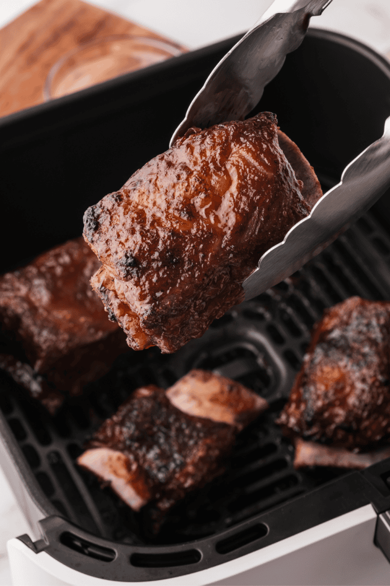A bowl of homemade Texas Roadhouse rib seasoning with a blend of spices, ready to be used for grilling or smoking ribs.