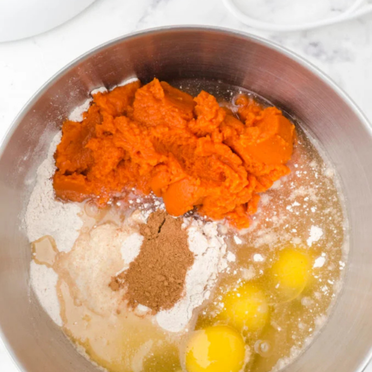 Pumpkin puree, eggs and oil added to the dry ingredients before stirring