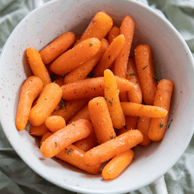 Easy Copycat Cheddar's Carrots – tender, glazed carrots in a white bowl, ready to serve.