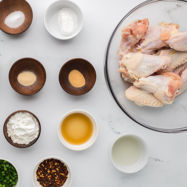 Ingredients for air fryer Chinese chicken wings laid out on a kitchen counter.