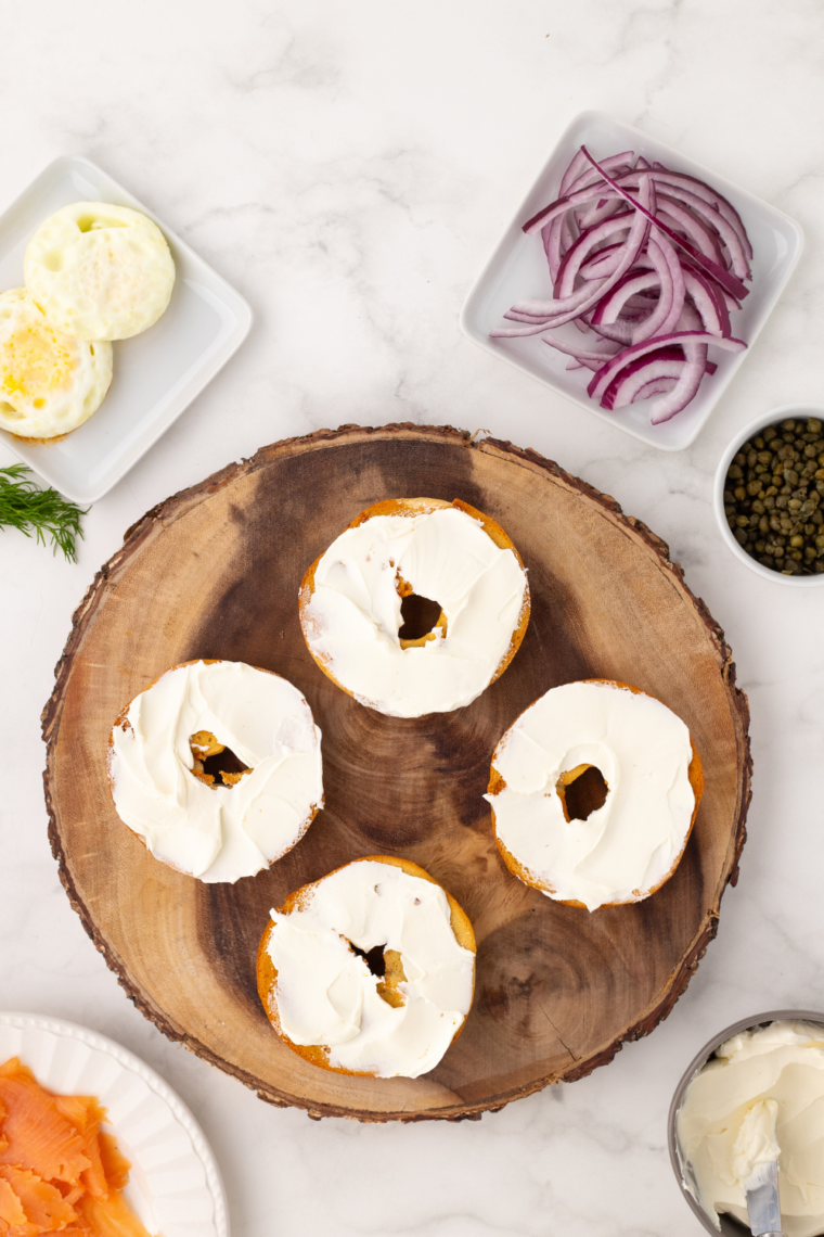 Air Fryer Toasted Bagel on wooden cutting board.