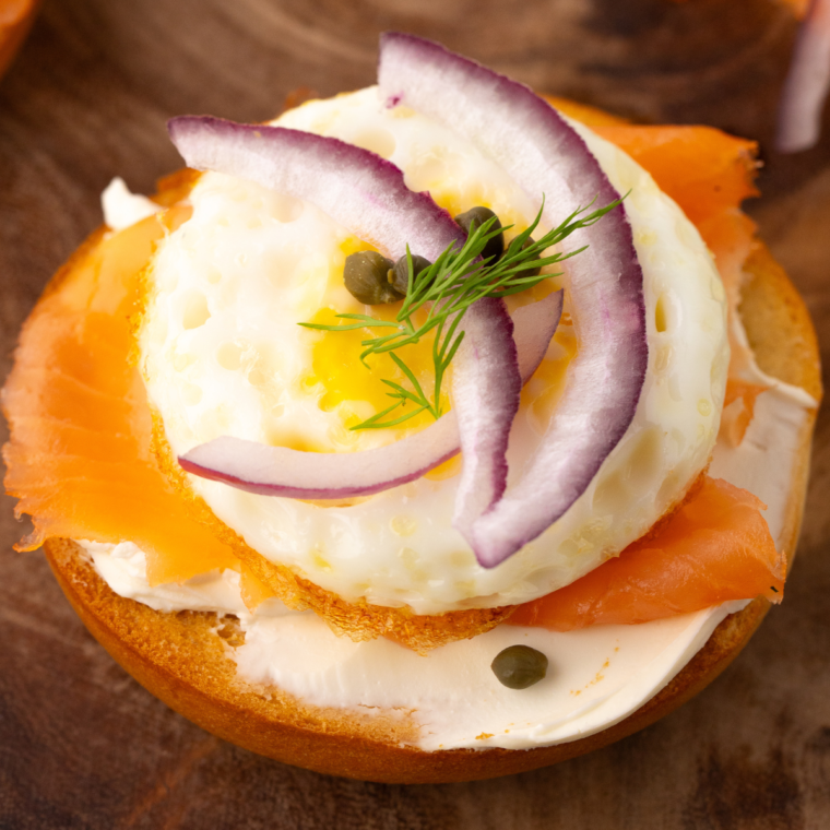 Step-by-step guide for toasting bagels in an air fryer, showcasing the process and perfectly toasted bagels.