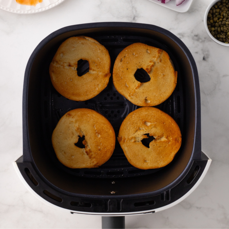 Step-by-step guide for toasting bagels in an air fryer, showcasing the process and perfectly toasted bagels.
