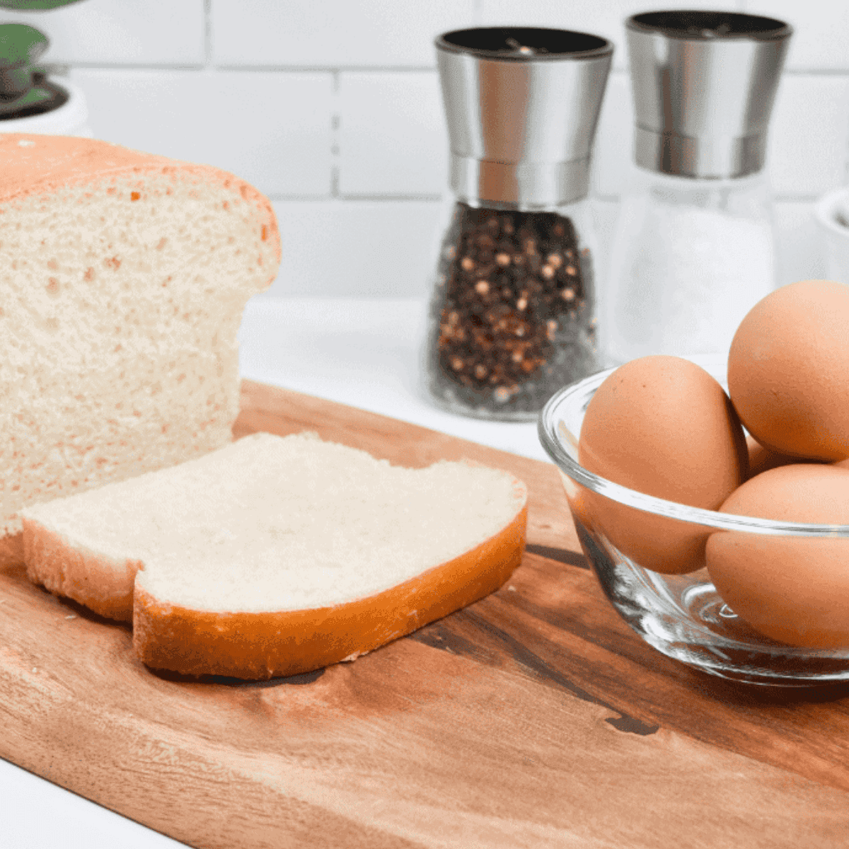Ingredients needed for Cracker Barrel Egg in a Basket on kitchen table.