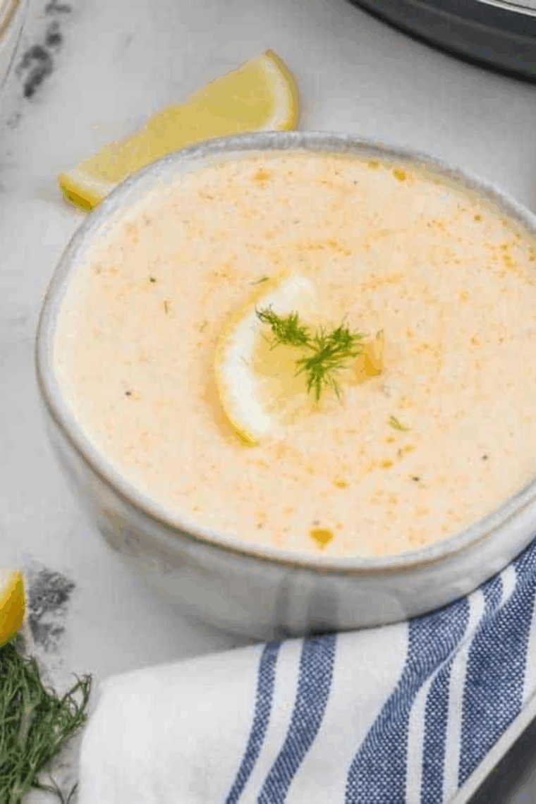 Creamy South Carolina she-crab soup served in a bowl, garnished with crab meat and herbs