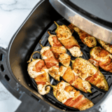 Air Fryer Bacon Wrapped Jalapeno Poppers in the air fryer basket