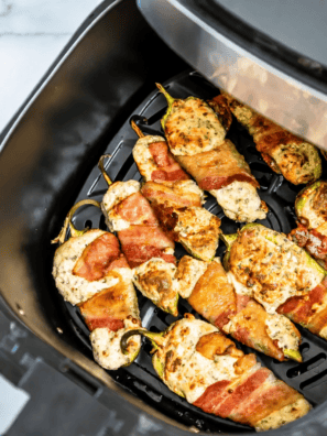 Air Fryer Bacon Wrapped Jalapeno Poppers in the air fryer basket