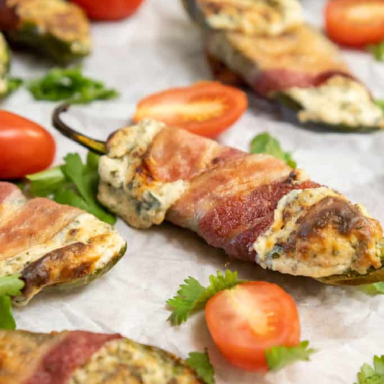 Experimenting with recipe variations for Air Fryer JalapeƱo Poppers can add an exciting twist to this classic appetizer. Here are some creative ideas to try:
Air Fryer Bacon-Wrapped Poppers: One of the most popular is bacon jalapeƱo poppers. For added flavor and texture, wrap each stuffed jalapeƱo with a strip of thick-cut bacon before air frying. The bacon adds a smoky, savory element.
Buffalo Chicken Poppers: Mix shredded cooked chicken with buffalo sauce into the cream cheese filling for a spicy kick and a nod to buffalo chicken wings.
Vegetarian Poppers: Replace the cheese with a vegan cheese alternative and add finely chopped vegetables like bell peppers or mushrooms to the filling for a vegetarian version.
Crab Stuffed Poppers: Add some cooked, finely shredded crab meat to the cream cheese mixture for a seafood twist on the classic popper.
Tex-Mex Poppers: Mix in taco seasoning, a small amount of salsa, and a blend of cheddar and Monterey Jack cheeses into the cream cheese for a Tex-Mex flair.
Sweet and Spicy Poppers: Add a spoonful of pineapple or mango salsa and 1 tablespoon of jalapeƱo juice to the cheese filling for a sweet and spicy combination.
Three-Cheese Poppers: Combine cream cheese, shredded cheddar, onion powder, and mozzarella or Parmesan for a more complex cheese flavor.
Greek Style Poppers: Mix feta cheese, spinach, and a bit of dill into the filling for a Mediterranean-inspired variation.
BBQ Poppers: Brush the stuffed poppers with your favorite BBQ sauce before air frying for a tangy and sweet finish.
Italian Poppers: Add chopped sun-dried tomatoes, basil, and mozzarella to the cream cheese filling for an Italian twist.
Each variation has a unique flavor and can be tailored to different tastes and occasions. Feel free to get creative and experiment with different fillings and toppings to discover your favorite version of Air Fryer JalapeƱo Poppers!
Pro Tips