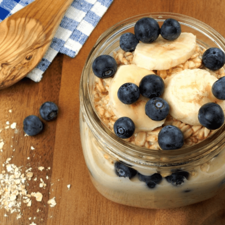 Reheated oatmeal with fresh fruit on table