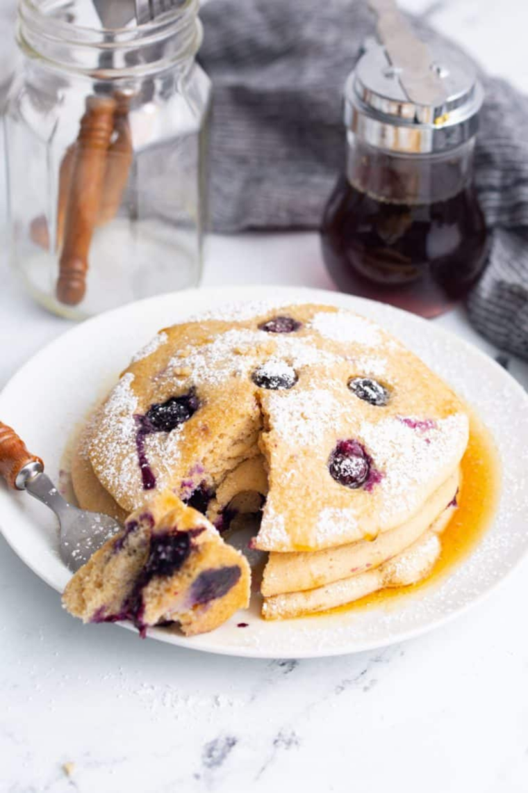 Homemade pancakes cooking in air fryer basket until golden brown