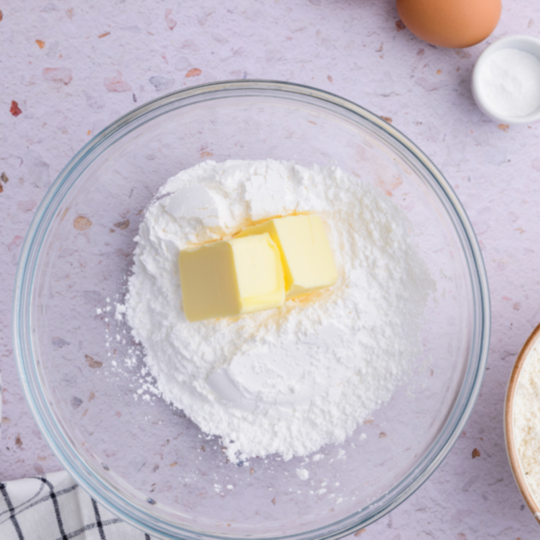 Mashing 3–4 very ripe bananas in a large mixing bowl