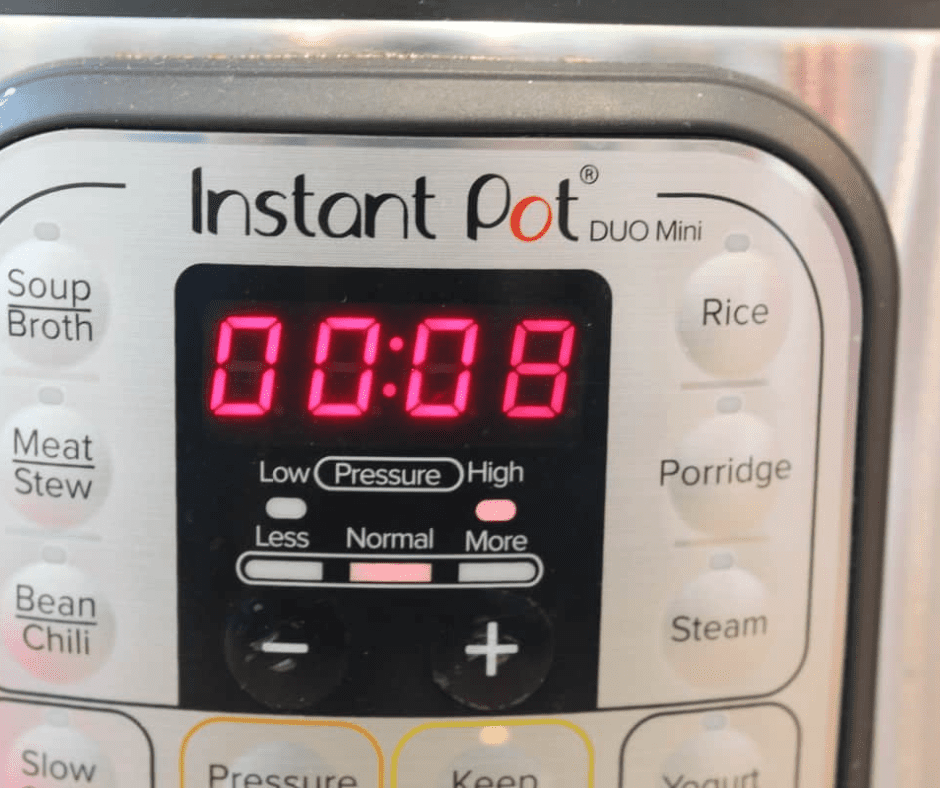 Blueberries, sugar, and lemon juice added to the Instant Pot, lid secured, and valve set to the sealed position, ready for cooking on high pressure.