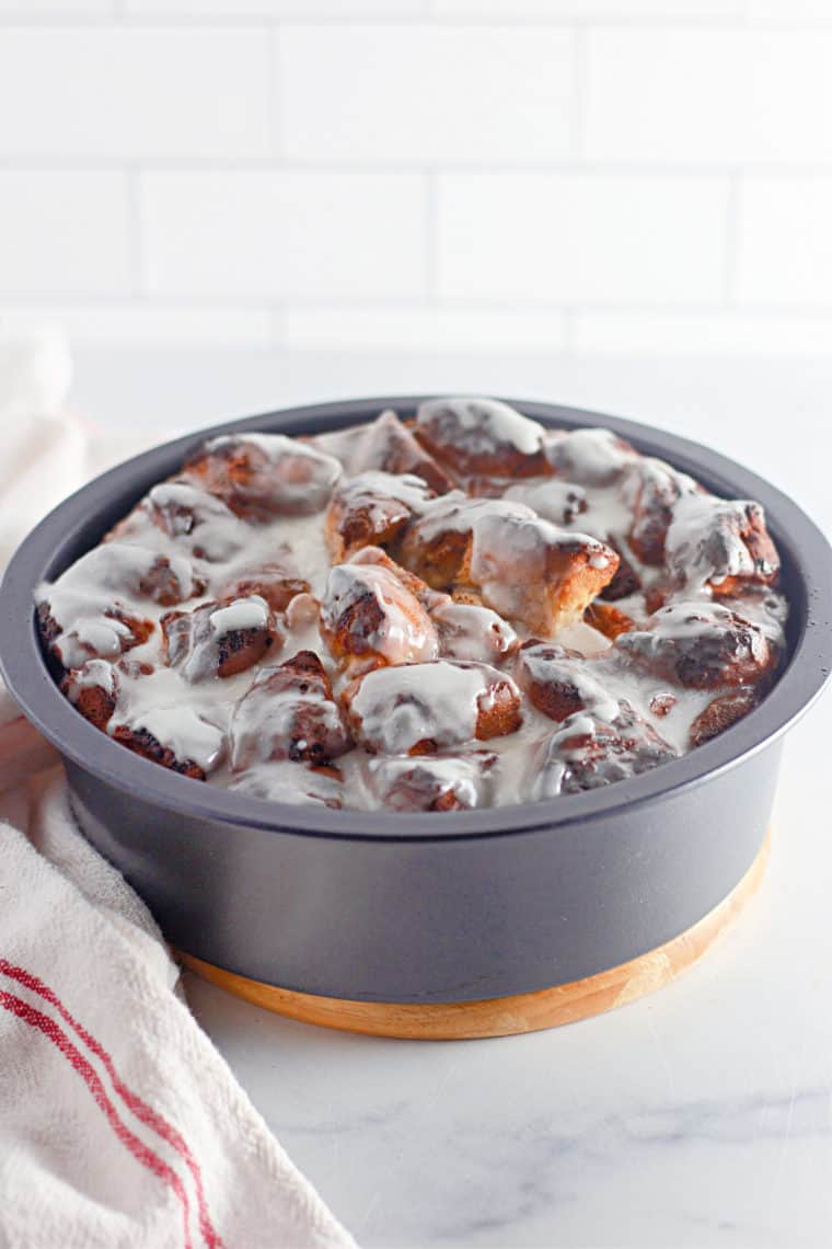 "Close-up of golden-brown Air Fryer Cinnamon Roll French Toast topped with fresh berries."