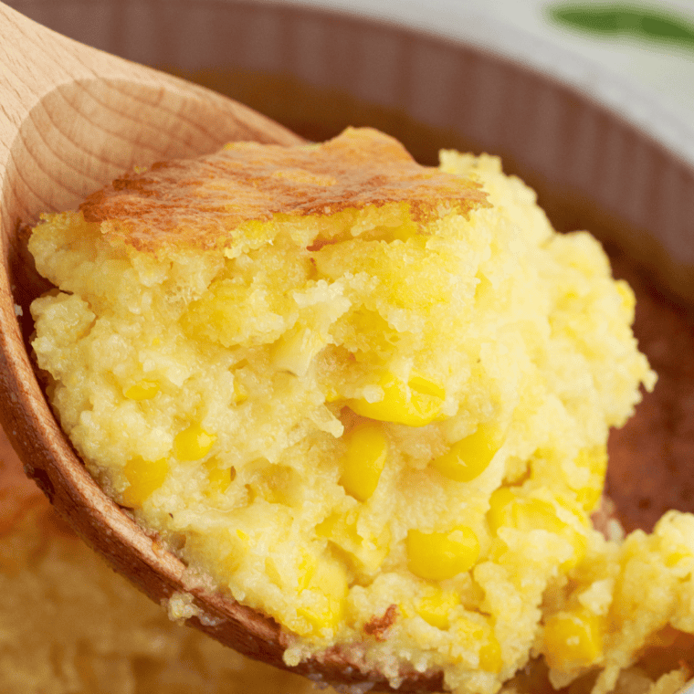 A slice of creamy air fryer Jiffy corn casserole with a golden, crispy top