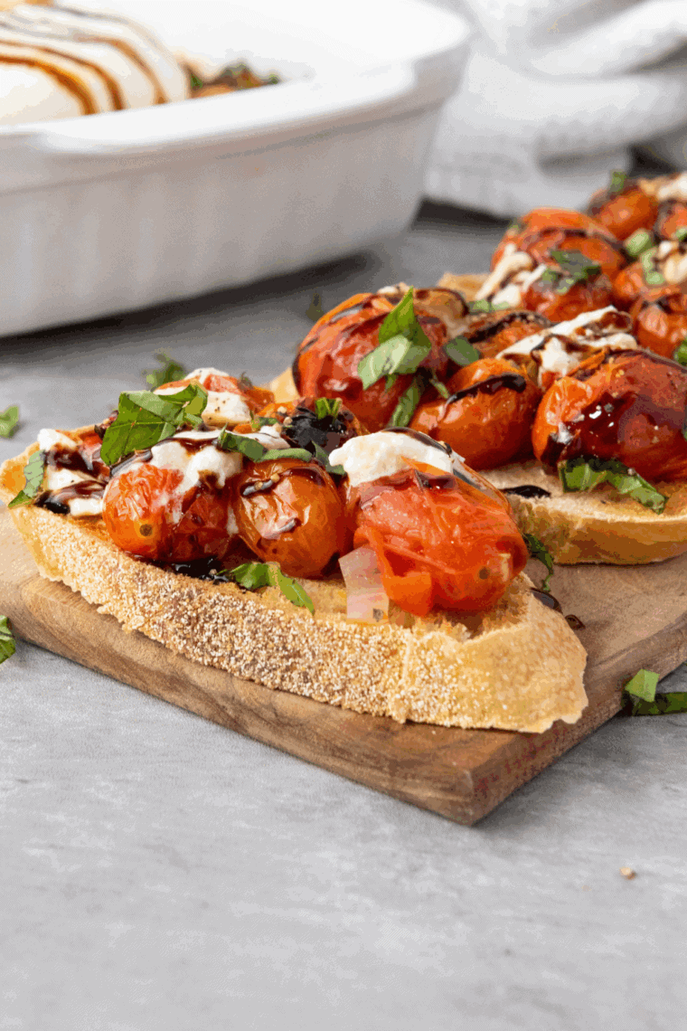 Toasted bruschetta topped with fresh tomato, burrata, basil, and balsamic glaze, Cheesecake Factory copycat style.