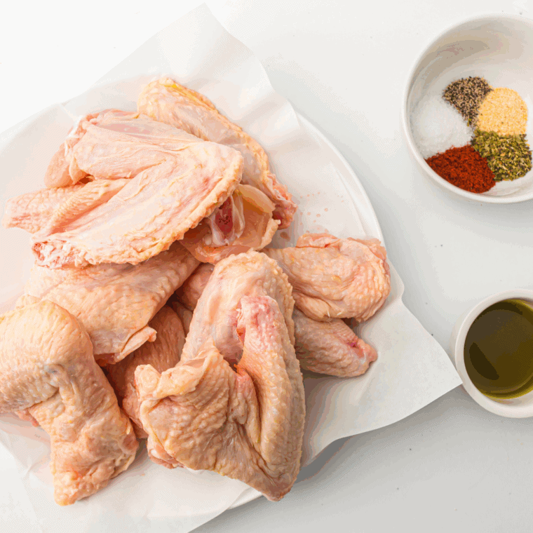 Ingredients needed for Air Fryer Lemon Dijon Chicken Wings on kitchen table.