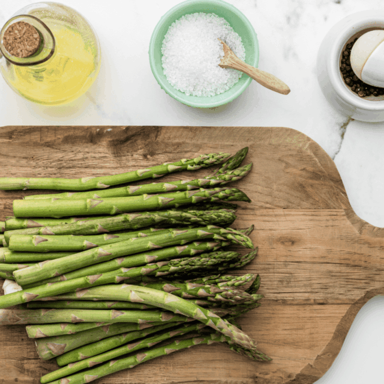 Cutting the spears off of the asparagus.