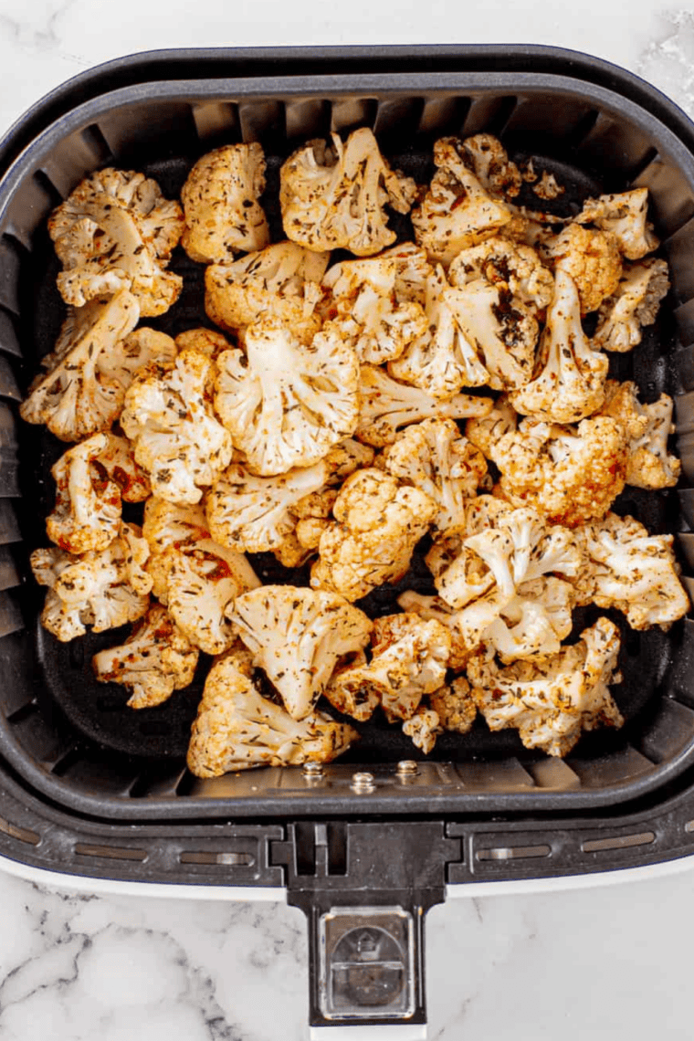 Crispy golden Air Fryer Cauliflower on a plate, seasoned and ready to serve.