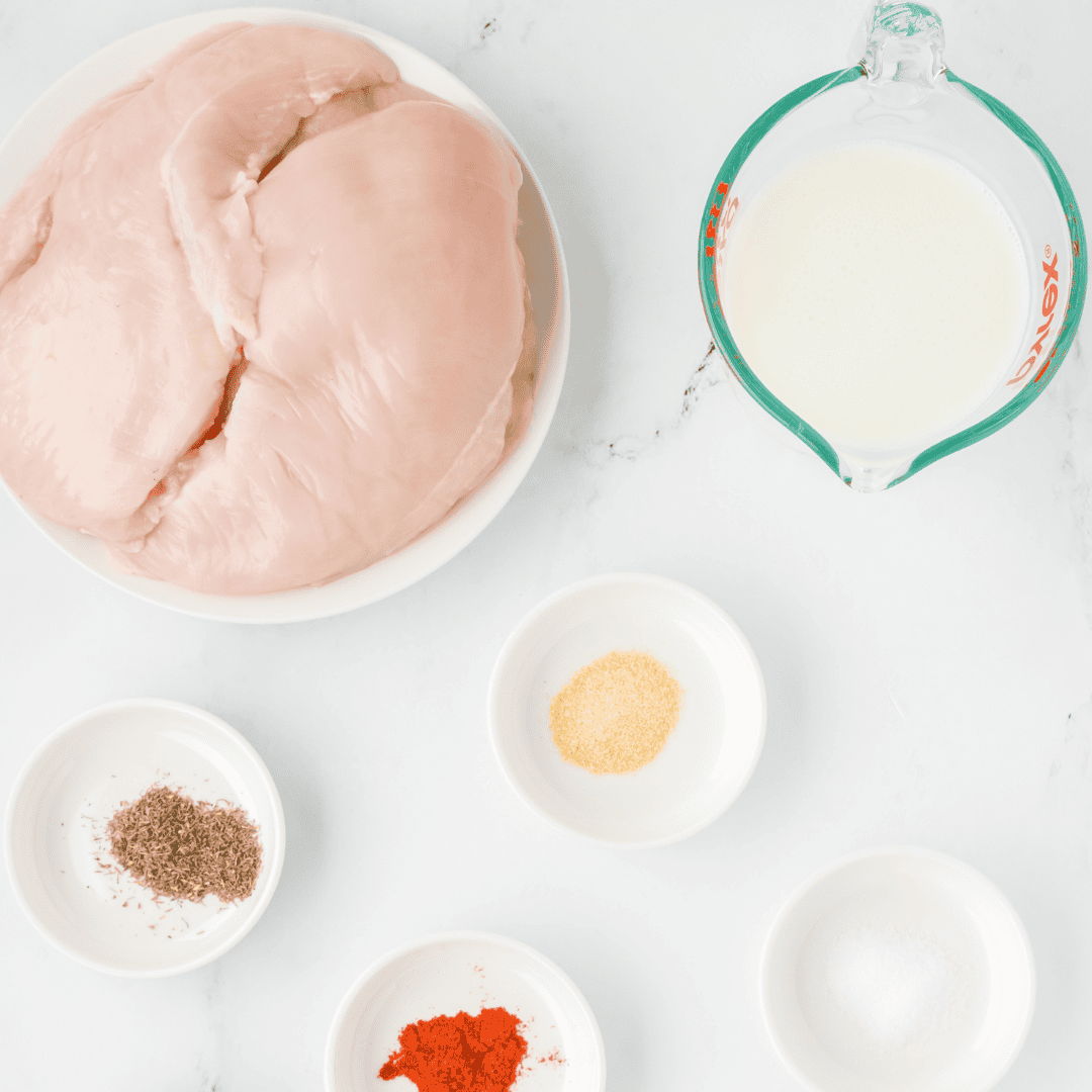 Ingredients for air fryer buttermilk chicken breast: chicken, buttermilk, salt, pepper, and thyme