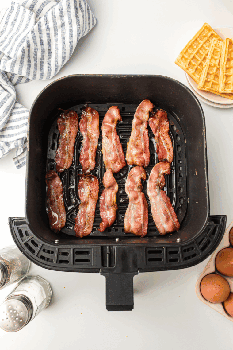 Cooked Air Fryer Maple Bacon in the air fryer basket.