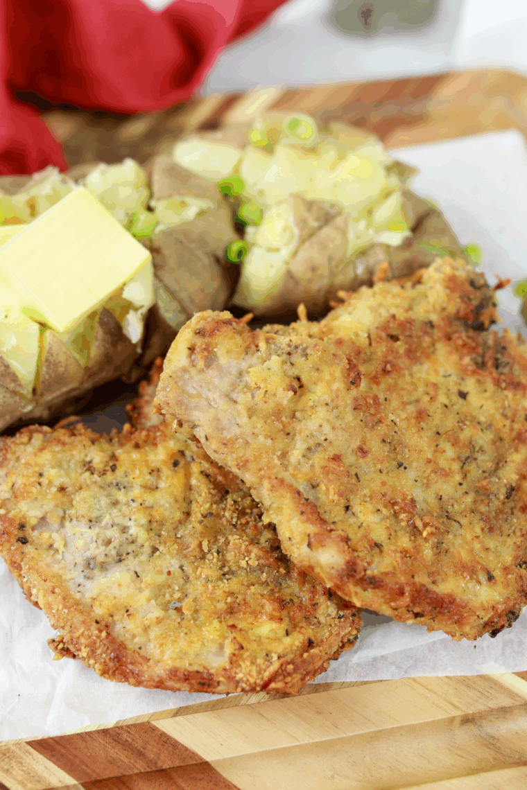 Easy Applebee’s Parmesan pork chops with crispy golden Parmesan crust on plate