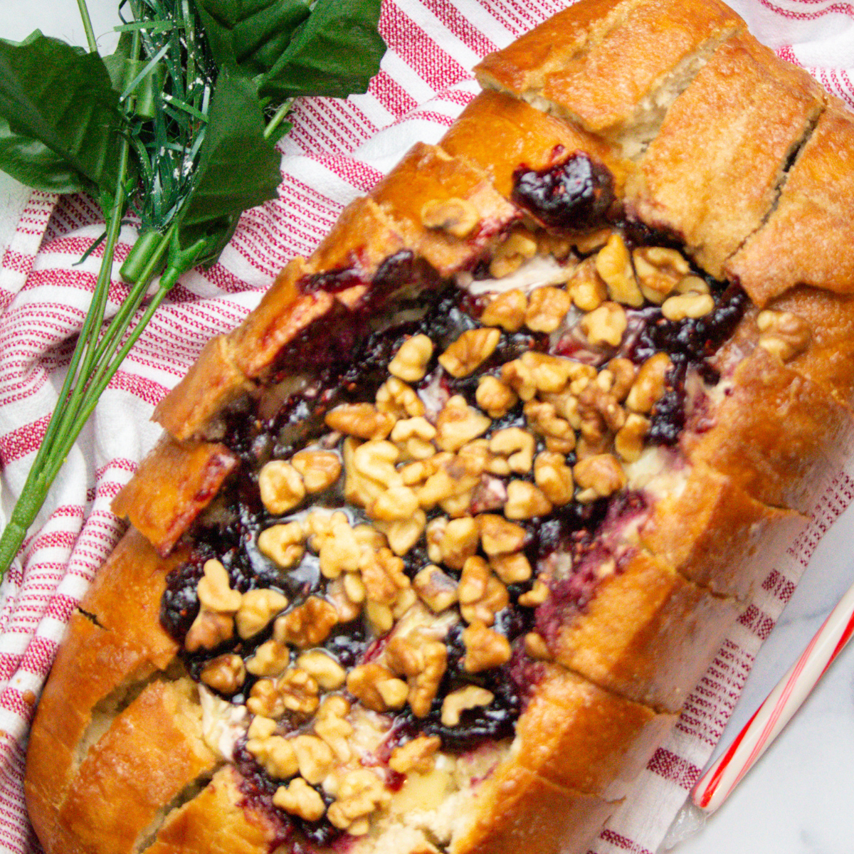 "Golden pull-apart bread filled with melted Brie cheese and raspberries, made in the air fryer"
