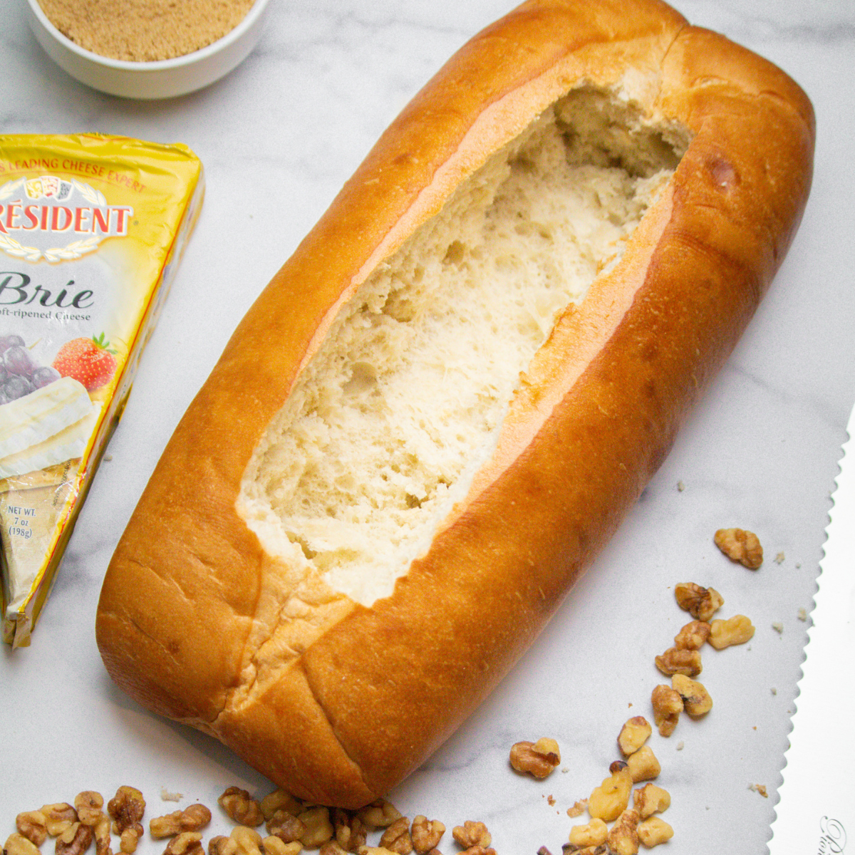 Ingredients Needed For Air Fryer Raspberry and Brie Pull-Apart Bread on kitchen table.