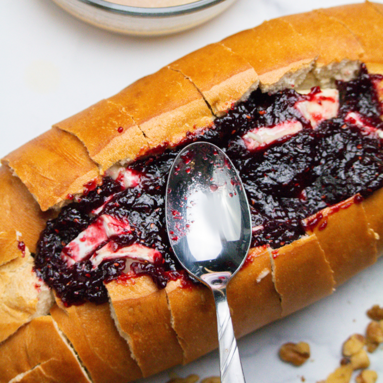 Add the jam on top of the brie.