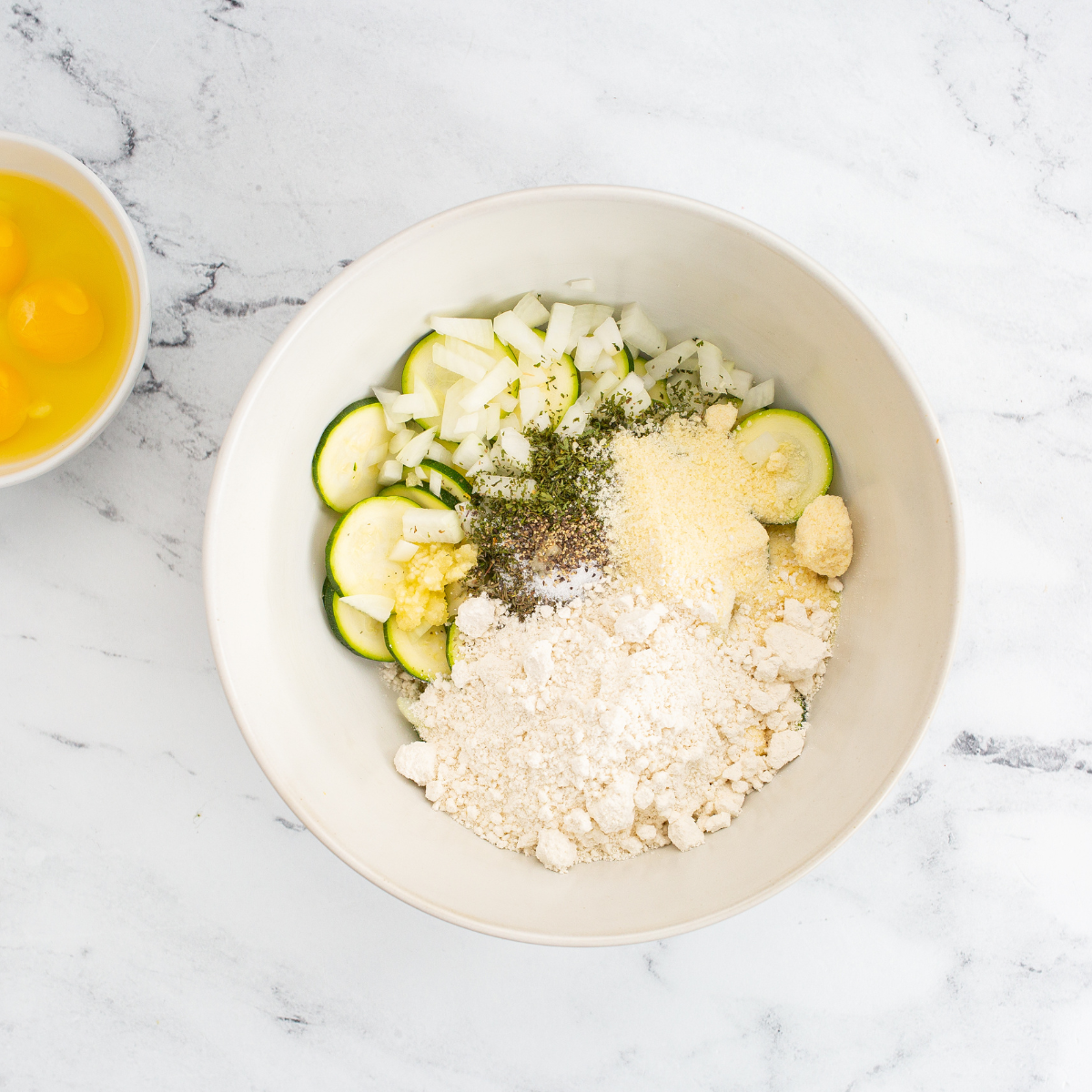 Chop zucchini and onion into small pieces for casserole.