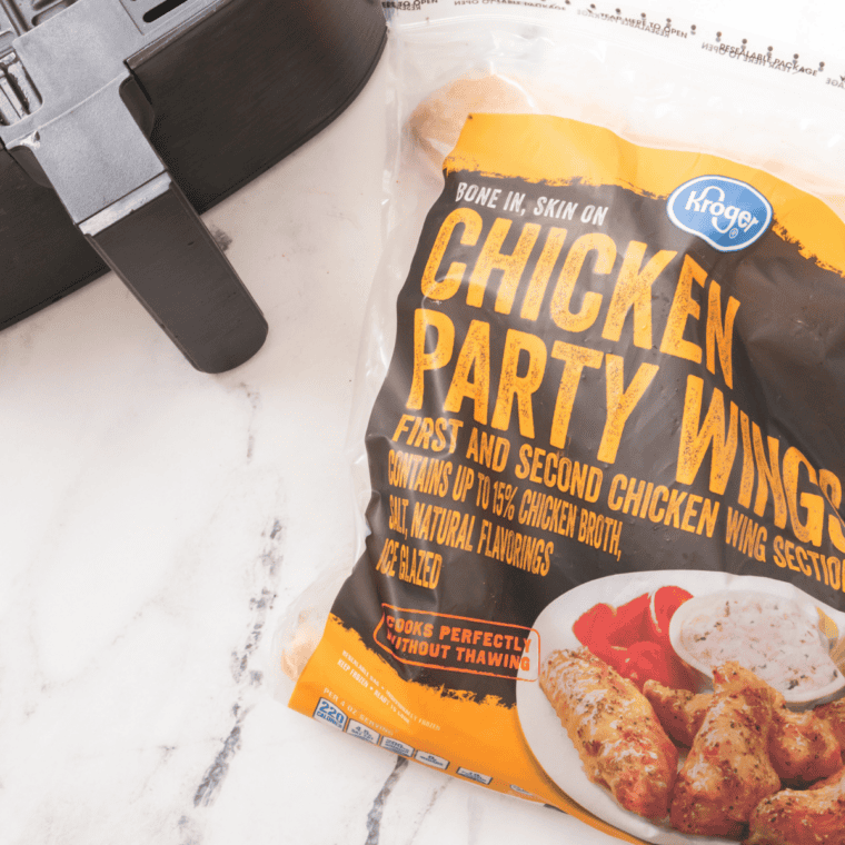 Raw frozen chicken wings with olive oil, baking powder, kosher salt, pepper, and garlic powder