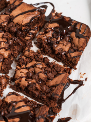 Copycat Starbucks double chocolate brownies cut into squares with chocolate chunks on top